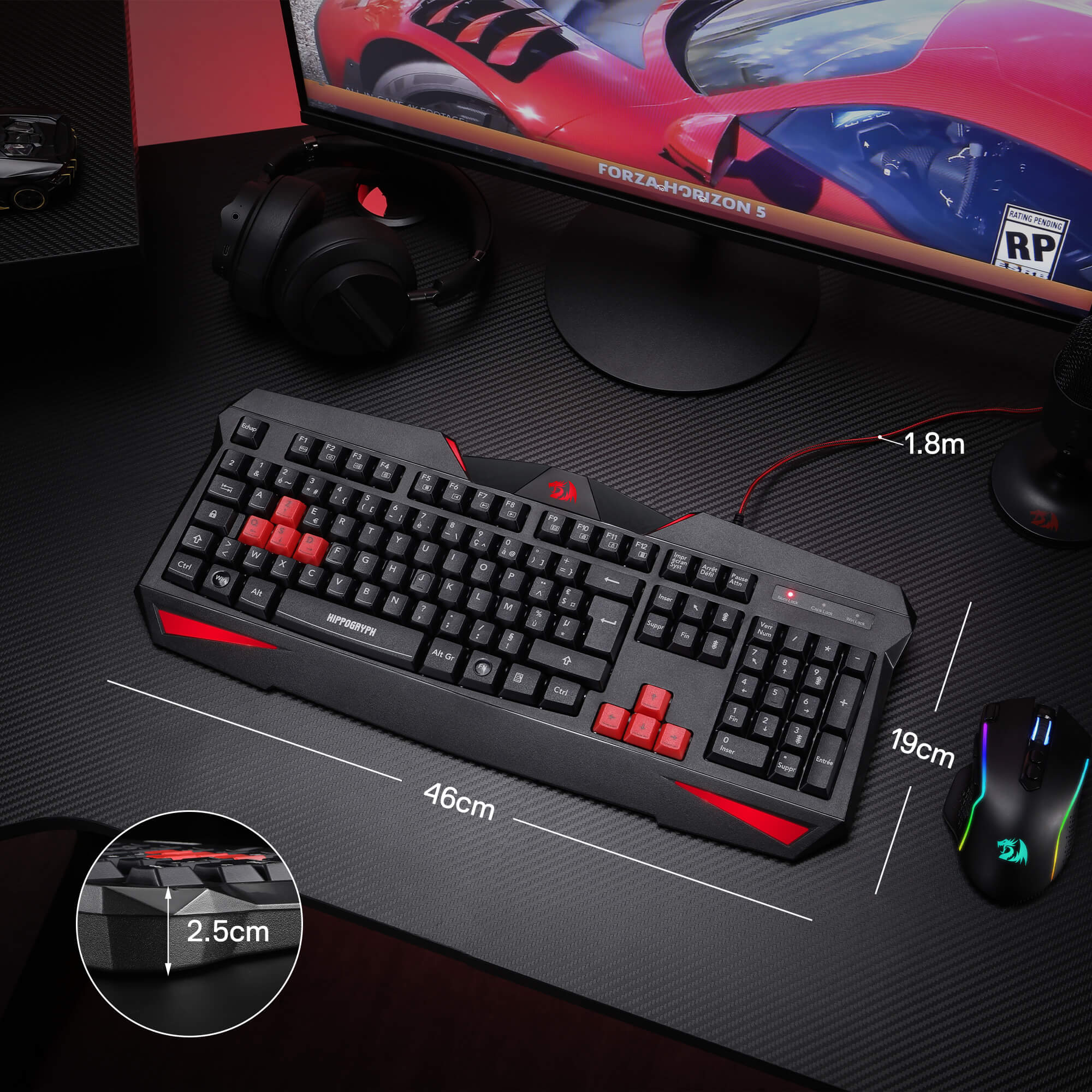 Gaming keyboard with red accents on a desk setup with a monitor, mouse, and headset.